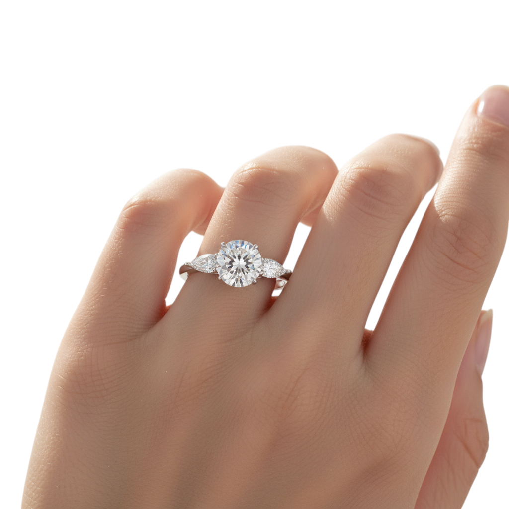 Claw sterling silver 925 ring with gold plating, featuring a large oval-cut center stone and two pear-cut side stones.